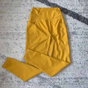 Women’s yellow Paragon leggings size M